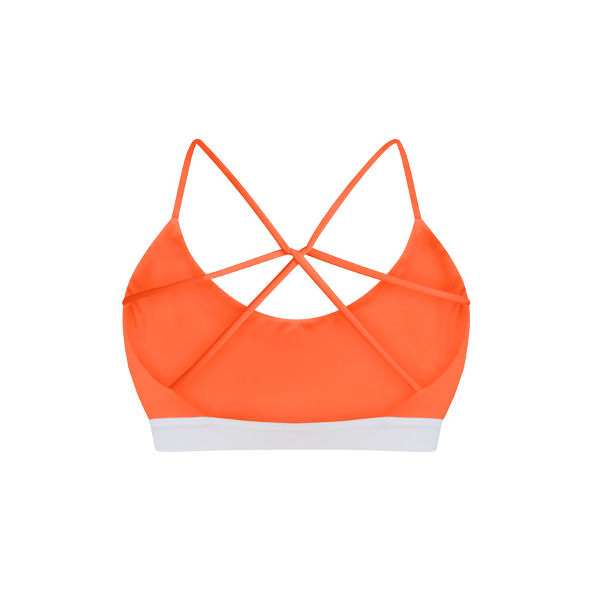 Orange swimwear top with criss-cross straps on a white background