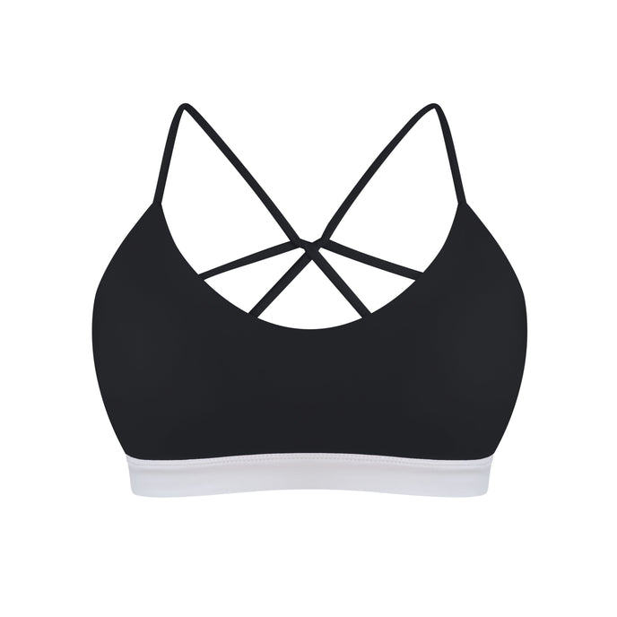 Black high-support swimming top with white trim on a white background