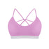Purple sports bra with criss-cross straps on a white background